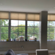 Honeycomb shades installation on the huge window