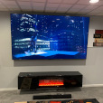 A large TV and TV stand are hung. All wires are hidden