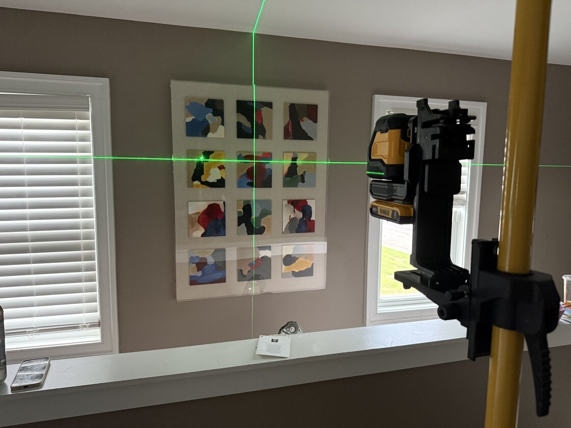 Another painting hung with laser precision