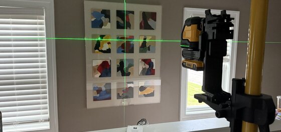 Another painting hung with laser precision
