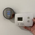 The old thermostat has retired. A new, smart, and energy-filled thermostat is now on duty, serving its owner.