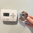 Replacement of an outdated thermostat with a new Google Smart Wi-Fi Thermostat.